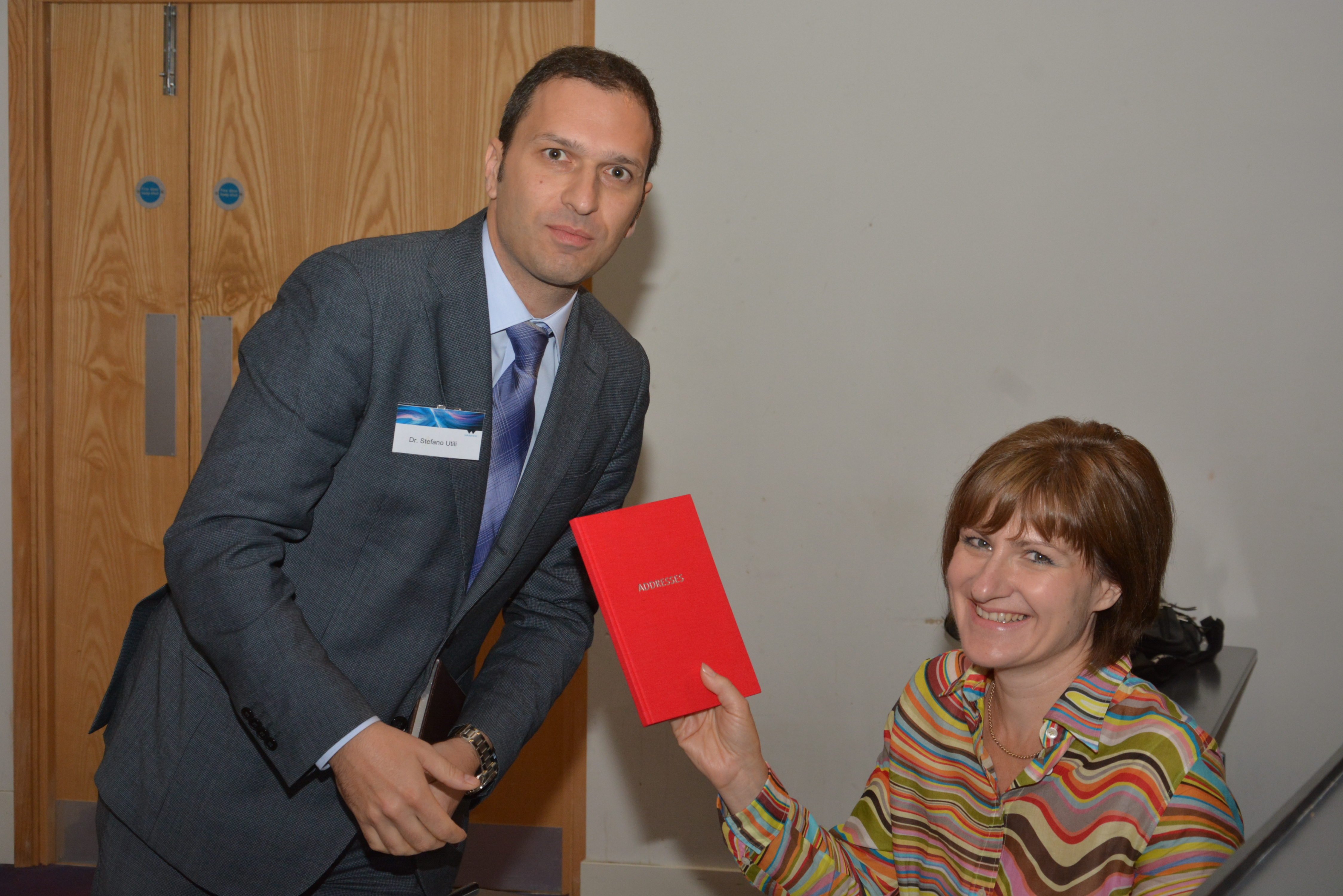 Prof. Stephanie Glendinning receiving a gift for her participation from Dr Stefano Utili