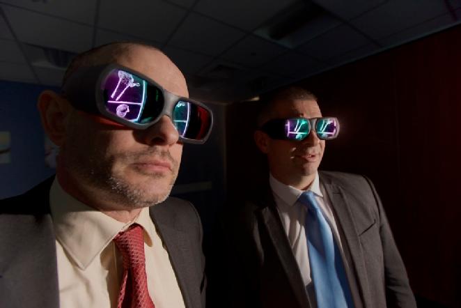 Professor Mark Williams (left) and Detective Superintendent Mark Payne (right) use a 3D virtual reality wall to analyse murder victim Michael Spalding