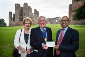 Former Mayor of Kenilworth Michael Coker and his wife Janice present a cheque for £3,000 to the Dean of Warwick Medical School Sudhesh Kumar to help with diabetes research.
