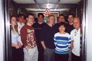 pixelated photo of group in lift in 2002