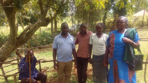 David Ngira Otieno, Kenya-based research assistant,(standing, left), observes community discussion of woman-to-woman marriage