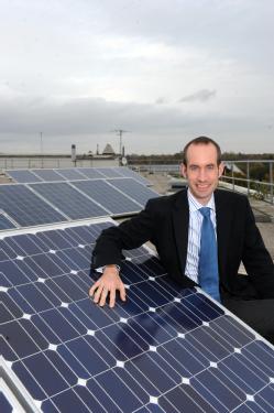 Dr Stan Shire with the New World Solar panels