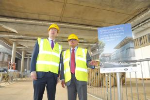 	Secretary of state Greg Clark MP and Professor Lord Bhattacharyya (WMG, University of Warwick) see construction work at  the National Automotive Innovation Centre 2017