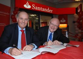 Luis Juste, area director UK and Portugal, Santander Universities, and Vice Chancellor Nigel Thrift sign the papers