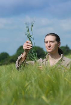 Professor Robin Allaby, University of Warwick in a field of barley