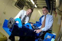 Mark Amor-Segan and Chris Bale (L-R) examine the hybrid powertrain test facility