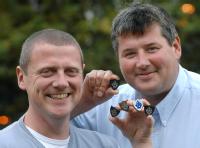Dr Kerry Kirwan and Dr Steve Maggs woth Blue Peter Badges
