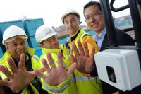 Robert Senior (Site Engineer), Phil Bardsley (Section manager) and Rodney Holland (Managing Director of the equipment's Installation Company - DCS) and Dr Li Wang on far right - builders showing abraded fingerprints, and BioLog equipment in use on a Coventry building site
