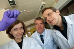 Chemistry PhD student Helena Stec with some ultra-thin gold film, watched by Professor Tim Jones, Chemistry, and Dr Ross Hatton, Chemistry University of Warwick