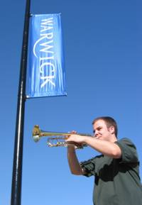 One of our trumpet players with a Warwick banner
